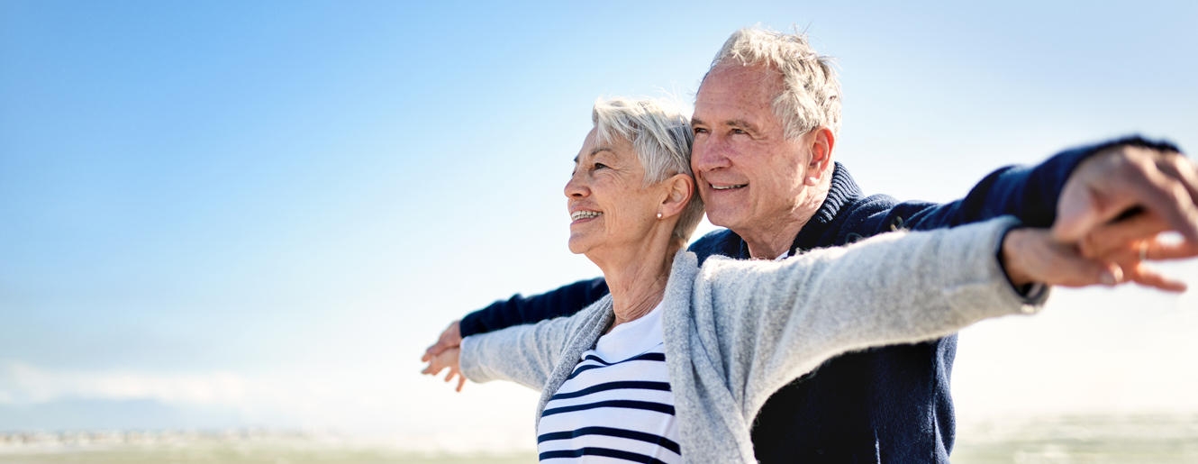 Mature couple outside smiling